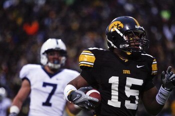 IOWA CITY, IA - NOVEMBER 8: Wide receiver Derrell Johnson-Koulianos #15 of the Iowa Hawkeyes scores a touchdown in the third quarter of play as Anthony Scirrotto #7 of the Penn State Nittany Lions defends on the play at Kinnick Stadium on November 8, 2008
