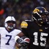 IOWA CITY, IA - NOVEMBER 8: Wide receiver Derrell Johnson-Koulianos #15 of the Iowa Hawkeyes scores a touchdown in the third quarter of play as Anthony Scirrotto #7 of the Penn State Nittany Lions defends on the play at Kinnick Stadium on November 8, 2008