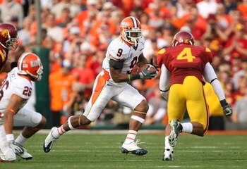 PASADENA, CA - JANUARY 01:  Wide receiver Arrelious Benn #9 of the Illinois Fighting Illini runs for yardage against Kevin Ellison #4 of the USC Trojans during the Rose Bowl presented by Citi at the Rose Bowl on January 1, 2008 in Pasadena, California. Th