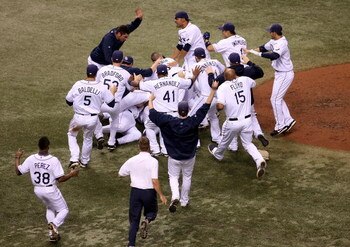 ST PETERSBURG, FL - OCTOBER 19:  The Tampa Bay Rays celebrate after defeating the Boston Red Sox in game seven of the American League Championship Series during the 2008 MLB playoffs on October 19, 2008 at Tropicana Field in St Petersburg, Florida.  The R