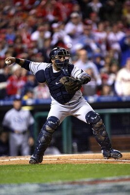 PHILADELPHIA - OCTOBER 25:  Dioner Navarro #30 of the Tampa Bay Rays looks to throw the ball against the Philadelphia Phillies during game three of the 2008 MLB World Series on October 25, 2008 at Citizens Bank Park in Philadelphia, Pennsylvania.  (Photo 