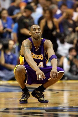 ORLANDO, FL - JUNE 14:  Kobe Bryant #24 of the Los Angeles Lakers smiles in the final moments of the Lakers' win over the Orlando Magic in Game Five of the 2009 NBA Finals on June 14, 2009 at Amway Arena in Orlando, Florida.  NOTE TO USER:  User expressly