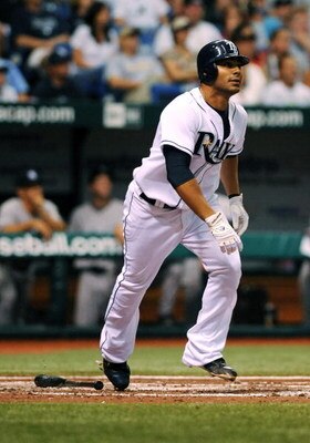 ST. PETERSBURG, FL - APRIL 15: Infielder Carlos Pena #23 of the Tampa Bay Rays homers against the New York Yankees at Tropicana Field on April 15, 2009 in St. Petersburg, Florida.  (Photo by Al Messerschmidt/Getty Images)
