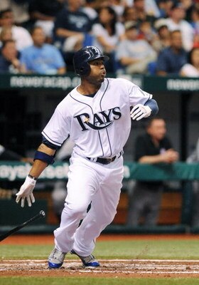 ST. PETERSBURG, FL - APRIL 15: Outfielder Carl Crawford #13 of the Tampa Bay Rays bats against the New York Yankees at Tropicana Field on April 15, 2009 in St. Petersburg, Florida.  (Photo by Al Messerschmidt/Getty Images)