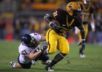 TEMPE, AZ - DECEMBER 01:  Dimitri Nance #31 of the Arizona State breaks the tackle of Spencer Larsen #51 of the University of Arizona Wildcats during the second quarter at Sun Devil Stadium on December 1, 2007 in Tempe, Arizona.  (Photo by Harry How/Getty