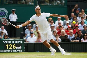 WIMBLEDON, ENGLAND - JUNE 26:  Roger Federer of Switzerland plays a forehand during the men's singles third round match against Philipp Kohlschreiber of Germany on Day Five of the Wimbledon Lawn Tennis Championships at the All England Lawn Tennis and Croq