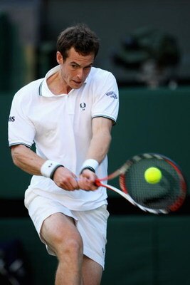 WIMBLEDON, ENGLAND - JUNE 23:  Andy Murray of Great Britain plays a backhand during the men's singles first round match against Robert Kendrick of USA on Day Two of the Wimbledon Lawn Tennis Championships at the All England Lawn Tennis and Croquet Club on