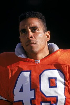 SAN FRANCISCO - AUGUST 3:  Safety Dennis Smith #49 of the Denver Broncos looks on during a game against the San Francisco 49ers at Candlestick Park on August 3, 1992 in San Francisco, California.  The 49ers won 13-7.  (Photo by George Rose/Getty Images)