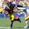 BERKELEY, CA - OCTOBER 25: Runningback Jahvid Best #4 of the Cal Golden Bears carries the ball as he avoids a tackle during the game against the UCLA Bruins at Memorial Stadium on October 25, 2008 in Berkeley, California. (Photo by Jeff Gross/Getty Images