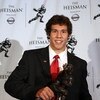 NEW YORK - DECEMBER 13:  Sam Bradford of the Oklahoma Sooners holds the Heisman Trophy on December 13, 2008 at the Sports Museum of America in New York City.  (Photo by Nick Laham/Getty Images)