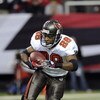 ATLANTA - DECEMBER 14: Running back Warrick Dunn #28 of the Tampa Bay Buccaneers rushes upfield against the Atlanta Falcons at the Georgia Dome on December 14, 2008 in Atlanta, Georgia.  (Photo by Al Messerschmidt/Getty Images)