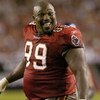 Tampa Bay Buccaneers defensive tackle Warren Sapp plays to the crowd after losing  his helmet while rushing  November 24, 2003 against the New York Giants  at Raymond James Stadium, Tampa.  (Photo by Al Messerschmidt/Getty Images)