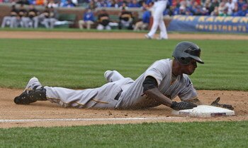 CHICAGO - MAY 27: Nyjer Morgan #3 of the Pittsburgh Pirates slides safely into third base on a 2-base error by Alfonso Soriano of the Chicago Cubs on May 27, 2009 at Wrigley Field in Chicago, Illinois. The Cubs defeated the Pirates 5-2. (Photo by Jonathan