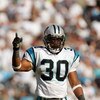 CHARLOTTE, NC - OCTOBER 1: Mike Minter #30 of the Carolina Panthers motions on the field during the game against the New Orleans Saints on October 1, 2006 at Bank of America Stadium in Charlotte, North Carolina.  (Photo By Streeter Lecka/Getty Images)