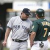 OAKLAND-APRIL 25: Jason Giambi #25 of the New York Yankees chats with brother Jeremy Giambi #7 of the Oakland A's during the game at Network Associates Coliseum in Oakland, California on April 25, 2002. The A's won 6-2. (Photo by Jed Jacobsohn/Getty Image
