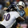 NASHVILLE, TN - JANUARY 10:  Quarterback Kerry Collins #5 of the Tennessee Titans is hit as he throws the ball by tackle Trevor Pryce #90 of the Baltimore Ravens during the AFC Divisional Playoff Game on January 10, 2009 at LP Field in Nashville, Tennesse
