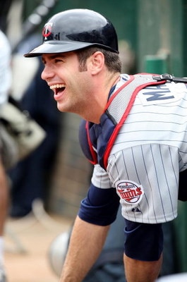 OAKLAND, CA - JUNE 11:  Joe Mauer #7 of the Minnesota Twins looks on against the Oakland Athletics during a Major League Baseball game on June 11, 2009 at the Oakland Coliseum in Oakland, California.  (Photo by Jed Jacobsohn/Getty Images)