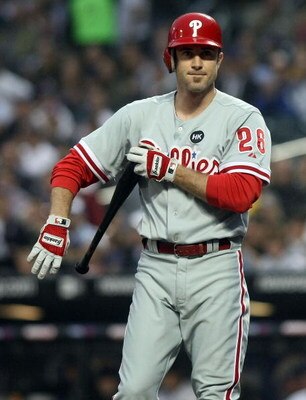 NEW YORK - JUNE 11:  Chase Utley #26 of the Philadelphia Phillies reacts after striking out against the New York Mets on June 11, 2009 at Citi Field in the Flushing neighborhood of the Queens borough of New York City.  (Photo by Nick Laham/Getty Images)