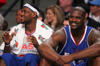 DENVER - FEBRUARY 20:   (L-R) LeBron James #23 and Shaquille O'Neal #32 of the Eastern Conference All-Stars smile on the bench in the final moments of the East's win over the Western Conference All-Stars the 54th All-Star Game, part of 2005 NBA All-Star W
