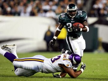 PHILADELPHIA - SEPTEMBER 20:  Brian Westbrook #36 of the Philadelphia Eagles is hit by Kevin Williams #93 of the Minnesota Vikings at Lincoln Financial Field on September 20, 2004 in Philadelphia, Pennsylvania. (Photo by Ezra Shaw/Getty Images)