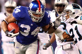 EAST RUTHERFORD, NJ - DECEMBER 21:  Derrick Ward #34 of the New York Giants runs the ball against the Carolina Panthers in overtime on December 21, 2008 at Giants Stadium in East Rutherford, New Jersey. (Photo by Jim McIsaac/Getty Images)