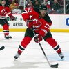 NEWARK, NJ - APRIL 11:  Johnny Oduya #29 of the New Jersey Devils skates against the Carolina Hurricanes at the Prudential Center on April 11, 2009 in Newark, New Jersey. The Devils defeated the Hurricanes 3-2.  (Photo by Jim McIsaac/Getty Images)