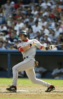 BRONX, NY - SEPTEMBER 7 :  Nomar Garciaparra #5 of the Boston Red Sox eyes his batted ball against the New York Yankees during the game at Yankee Stadium on September 7, 2003 in the Bronx, New York. The Yankees defeated the Red Sox 3-1. (Photo by Chris Tr