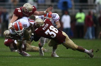 TALLAHASSEE, FL - NOVEMBER 29:  Receiver Jeffrey Demps #2 of the Florida Gators is brought down by linebacker Dekoda watson #36 of the Florida State Seminoles during the first half at Bobby Bowden Field at Doak Campbell Stadium on November 29, 2008 in Tal