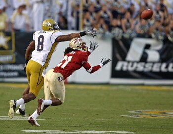 ATLANTA - NOVEMBER 1:  Cornerback Patrick Robinson #21 of the Florida State Seminoles gets position to intercept a fourth quarter pass while wide receiver Demaryius Thomas #8 of the Georgia Tech Yellow Jackets tries to break it up during the game at Bobby