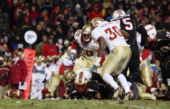 COLLEGE PARK, MD - NOVEMBER 22: DaRel Scott #23 of the Maryland Terrapins fumbles as Derek Nicholson #30 of the Florida State Seminoles prepares to recover the ball and run it in for a touchdown on November 22, 2008 at Byrd Stadium in College Park, Maryla