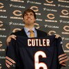 LAKE FOREST, IL - APRIL 3: Quarterback Jay Cutler of the Chicago Bears holds up his #6 jersey after he was introduced as their new quarterback during a press conference on April 3, 2009 at Halas Hall in Lake Forest, Illinois. (Photo by Jim Prisching/Getty
