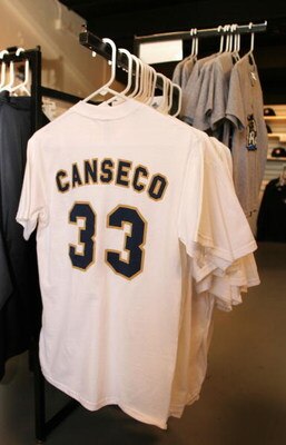 LONG BEACH, CA - JULY 14:  A Jose Canseco #33 tee shirt hangs on sale at the Golden Baseball League game between Long Beach Armada and the Fullerton Flyers on July 14,2006 at Blair Field in Long Beach, California.  (Photo By Christian Petersen/Getty Image