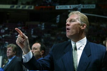 EAST RUTHERFORD, NJ - SEPTEMBER 27:  Assistant coach Jim Schoenfeld of the New York Rangers points from the bench during the NHL preseason game against the New Jersey Devils on September 27, 2002 at the Continental Airlines Arena in East Rutherford, New J