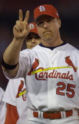 12 Oct 2001: Mark McGwire #25 of the St.Louis Cardinals salutes the crowd during team introductions before their game against the Arizona Diamondbacks at Busch Stadium in St. Louis, Missouri. DIGITAL IMAGE. Mandatory Credit: Elsa/ALLSPORT