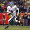 KANSAS CITY, MO - NOVEMBER 29:  Quarterback Todd Reesing #5of the Kansas Jayhawks runs to pass the ball during the game against the Missouri Tigers on November 29, 2008 at Arrowhead Stadium in Kansas City, Missouri. (Photo by Jamie Squire/Getty Images)