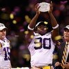 NEW ORLEANS - JANUARY 07:  Ricky Jean-Francois #90 of the Louisiana State University Tigers celebrates with the championship trophy after defeating the Ohio State Buckeyes 38-24 in the AllState BCS National Championship on January 7, 2008 at the Louisiana