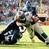MIAMI - NOVEMBER 09:  Running back Ronnie Brown #23 of the Miami Dolphins scores a touchdown in the fourth quarter as he is brought down by linebacker Julian Peterson #98 of the Seattle Seahawks at Dolphin Stadium on November 9, 2008 in Miami, Florida. Th