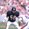 CHICAGO - OCTOBER 2:  Linebacker Mike Singletary #50 of the Chicago Bears prepares for a play as he stares down at the competition during a game against the Buffalo Bills at Soldier Field Stadium on October 2, 1988 in Chicago, Illinois.  The Bears won 24-