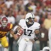 PASADENA, CA - JANUARY 1:  Daryll Clark #17 of the Penn State Nittany Lions scrambles against the USC Trojans on January 1, 2009 at the Rose Bowl in Pasadena, California.  USC won 38-24.  (Photo by Jeff Golden/Getty Images)