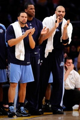 LOS ANGELES, CA - APRIL 27:  (lL-R) Deron Williams #8, Jarron Collins #31 and Carlos Boozer #5 of the Utah Jazz cheer on their team in the fourth quarter against the Los Angeles Lakers in Game Five of the Western Conference Quarterfinals during the 2009 N
