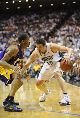 ORLANDO, FL - JUNE 14:  Hedo Turkoglu #15 of the Orlando Magic moves the ball against Trevor Ariza #3 of the Los Angeles Lakers in Game Five of the 2009 NBA Finals on June 14, 2009 at Amway Arena in Orlando, Florida. The Lakers won 99-86.  NOTE TO USER:  