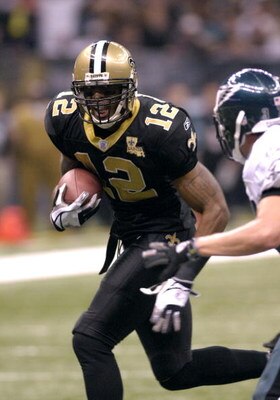 New Orleans Saints  wide receiver Marques Colston dashes for the end zone with a pass   against the Philadelphia Eagles in an NFL second-round playoff game on January 13, 2007 in the Superdome in New Orleans, Louisiana.  (Photo by Al Messerschmidt/Getty I