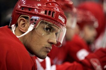 DETROIT - DECEMBER 1:  Steve Yzerman #19 of the Detroit Red Wings looks on from the bench against the Calgary Flames on December 1, 2005 at Joe Louis Arena in Detroit, Michigan.  Calgary won 3-2.  (Photo by Gregory Shamus/Getty Images)