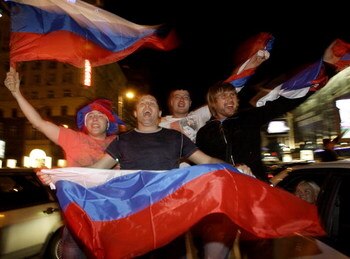 MOSCOW, RUSSIA - MAY 19:  Russian ice hockey fans celebrate victory in the streets after team Russia won the gold medal game against Canada at the 2008 IIHF World Hockey Championships in Canada, on May 19, 2008 in central Moscow, Russia.  (Photo by Epsilo