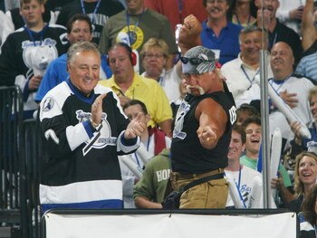 TAMPA, FL - MAY 25:  Hockey Hall of Famer Phil Esposito (L) applauds as professional wrestler Hulk Hogan gestures to his daugther Brooke Hogan who sang the National Anthem before the start of game one of the NHL Stanley Cup Finals between Calgary Flames a