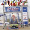 MIKOLAJKI, POLAND - JUNE 28:  Mikko Hirvonen and Jarmo Lehtinen of Finland celebrate their victory on the podium after the WRC Rally of Poland on June 28, 2009 in Mikolajki, Poland.  (Photo by Massimo Bettiol/Getty Images)