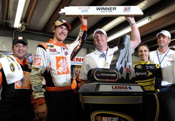 LOUDON, NH - JUNE 28:  Joey Logano, driver of the #20 Home Depot Toyota, celebrates winning the NASCAR Sprint Cup Series LENOX Industrial Tools 301 at New Hampshire Motor Speedway on June 28, 2009 in Loudon, New Hampshire. Logano won the rain shortened ra