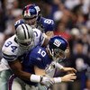 IRVING, TX - DECEMBER 14:  Quarterback Eli Manning #10 of the New York Giants fumbles the ball while sacked by DeMarcus Ware #94 of the Dallas Cowboys in the first quarter at Texas Stadium on December 14, 2008 in Irving, Texas.  (Photo by Ronald Martinez/