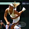 WIMBLEDON, ENGLAND - JUNE 24:  Maria Sharapova of Russia serves during the women's singles second round match against Gisela Dulko of Argentina on Day Three of the Wimbledon Lawn Tennis Championships at the All England Lawn Tennis and Croquet Club on June