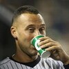 NEW YORK - JUNE 03:  Derek Jeter #2 of the New York Yankees in the dugout against the Texas Rangers on June 3, 2009 at Yankee Stadium in the Bronx borough of New York City.  (Photo by Nick Laham/Getty Images)